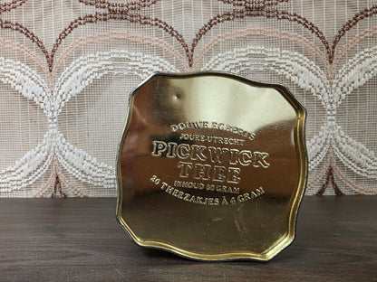 Onderkant van Pickwick theeblik met reliëftekst Douwe Egberts, Utrecht en inhoud 80 gram
