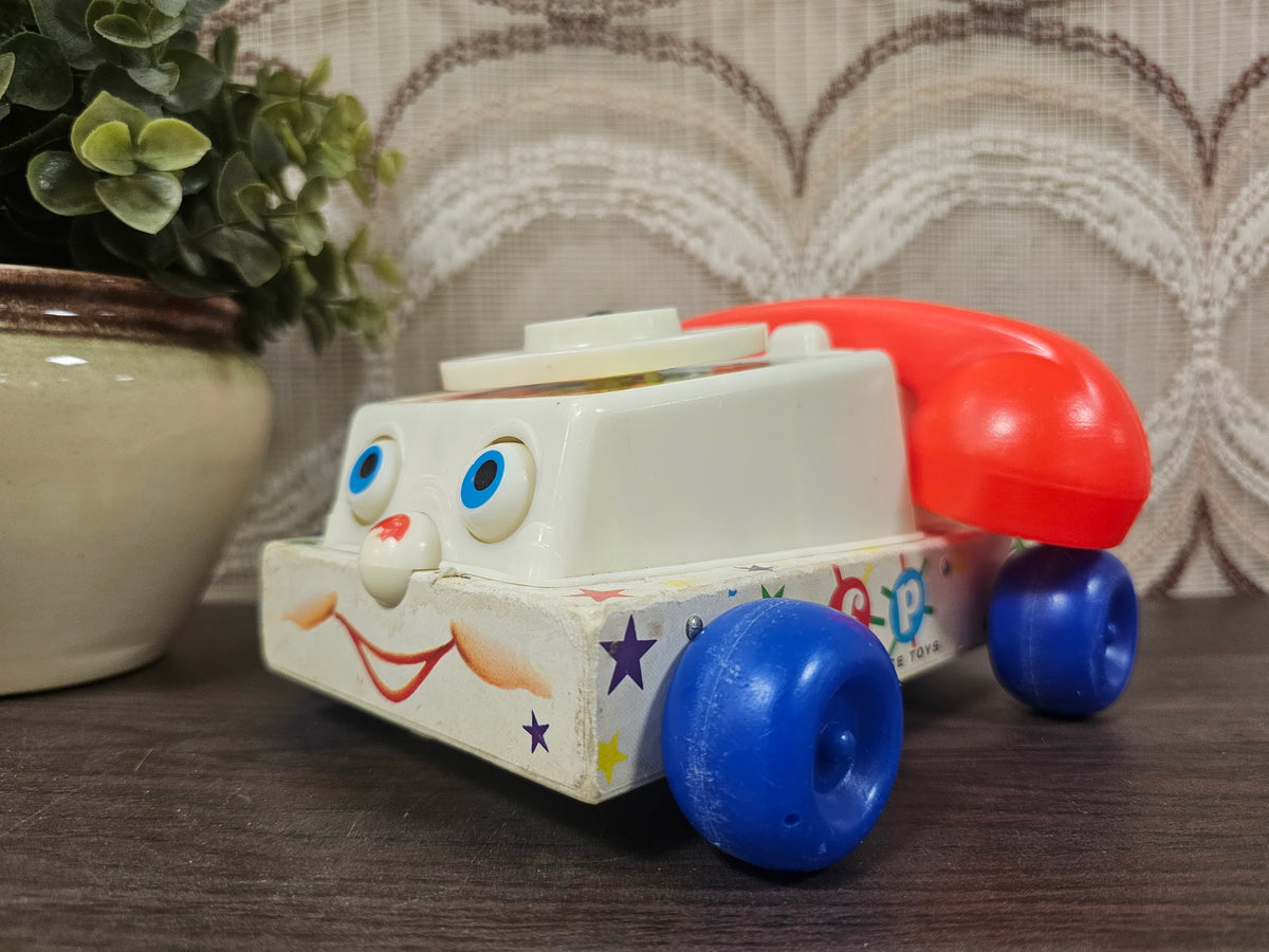 Fisher-Price Chatter speelgoedtelefoon met draaischijf en wieltjes