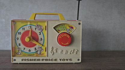 Fisher price vintage muziekdoosje met klok