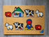 Houten Ravensburger knoppenpuzzel met acht Dick Bruna boerderijdieren en figuren, recht gedraaide overzichtsfoto