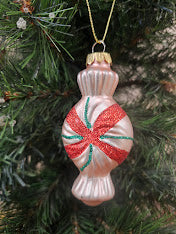 Retro kerstbal van glas in de vorm van een snoepje – roze met rode glitter