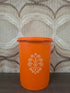 Vintage oranje Tupperware voorraadbus met wit decor en originele sterdeksel. 15.5 cm hoog