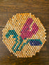 Vintage kralen onderzetter rode bloem